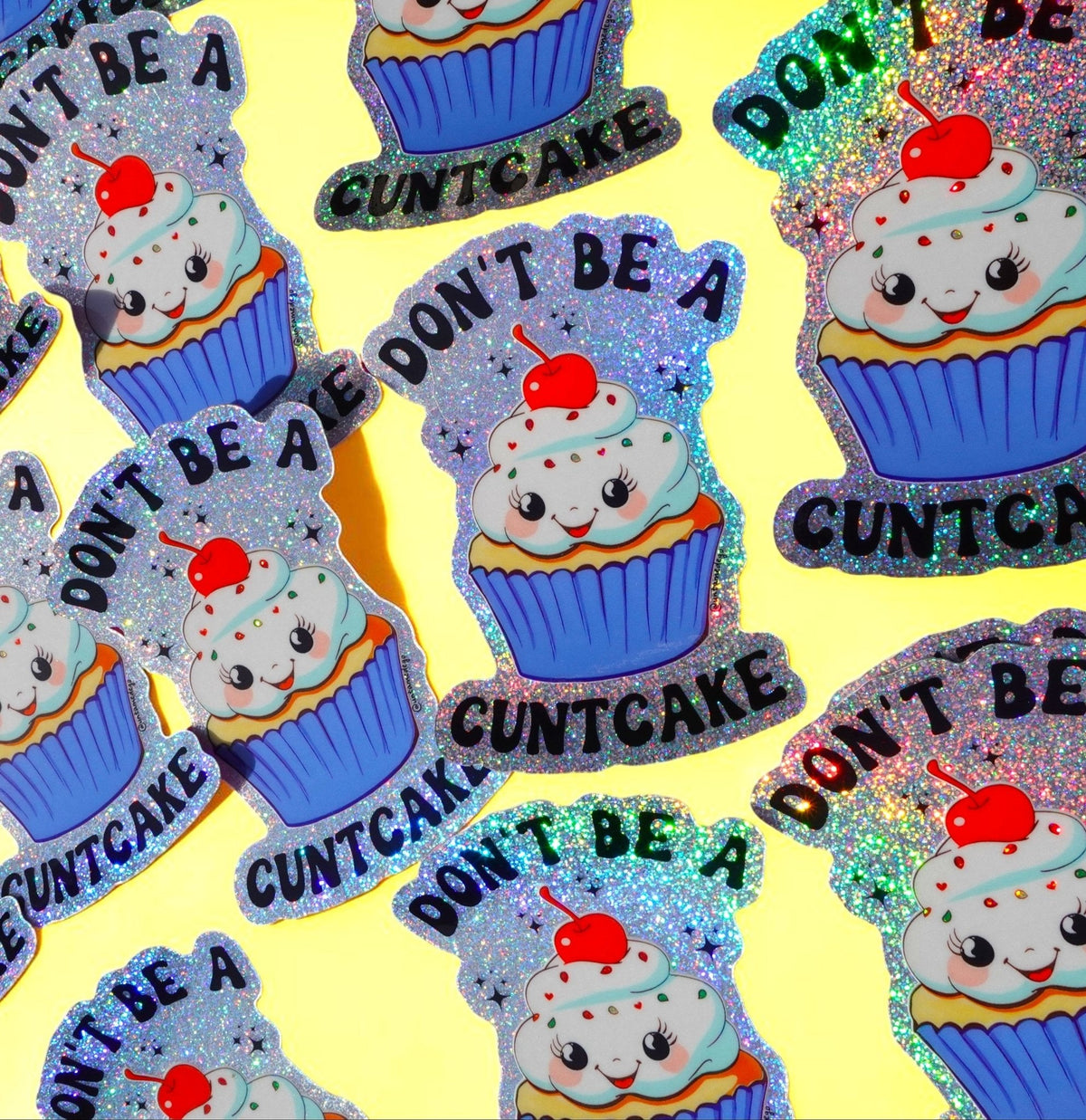 Funny Sheet of glitter cupcake cat stickers repeating “DON’T BE A” and “CUNTCAKE”