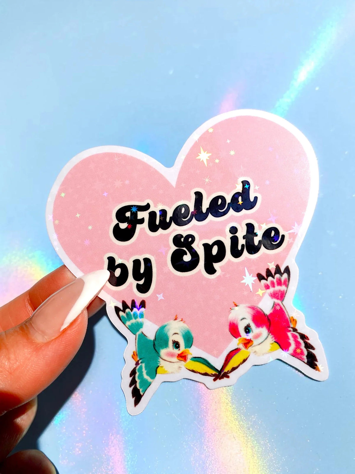 Funny Pink heart-shaped sticker with “Fueled by Spite” text and two cute animals holding flowers