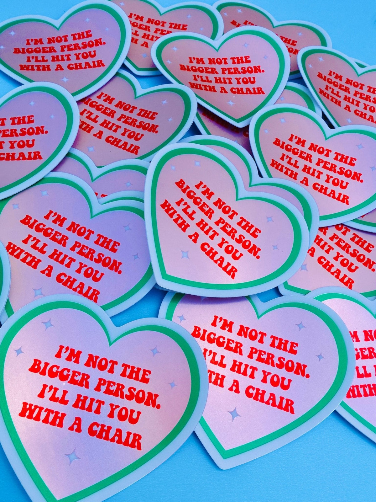 Funny Assorted heart-shaped stickers with pink centers, green borders, and red quote text