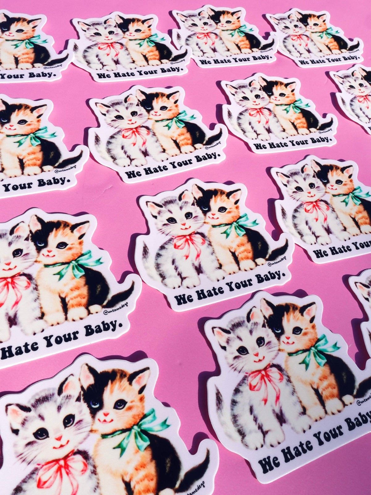 Funny Set of cat and kitten stickers with "We Hate Your Baby." text in repeating pattern