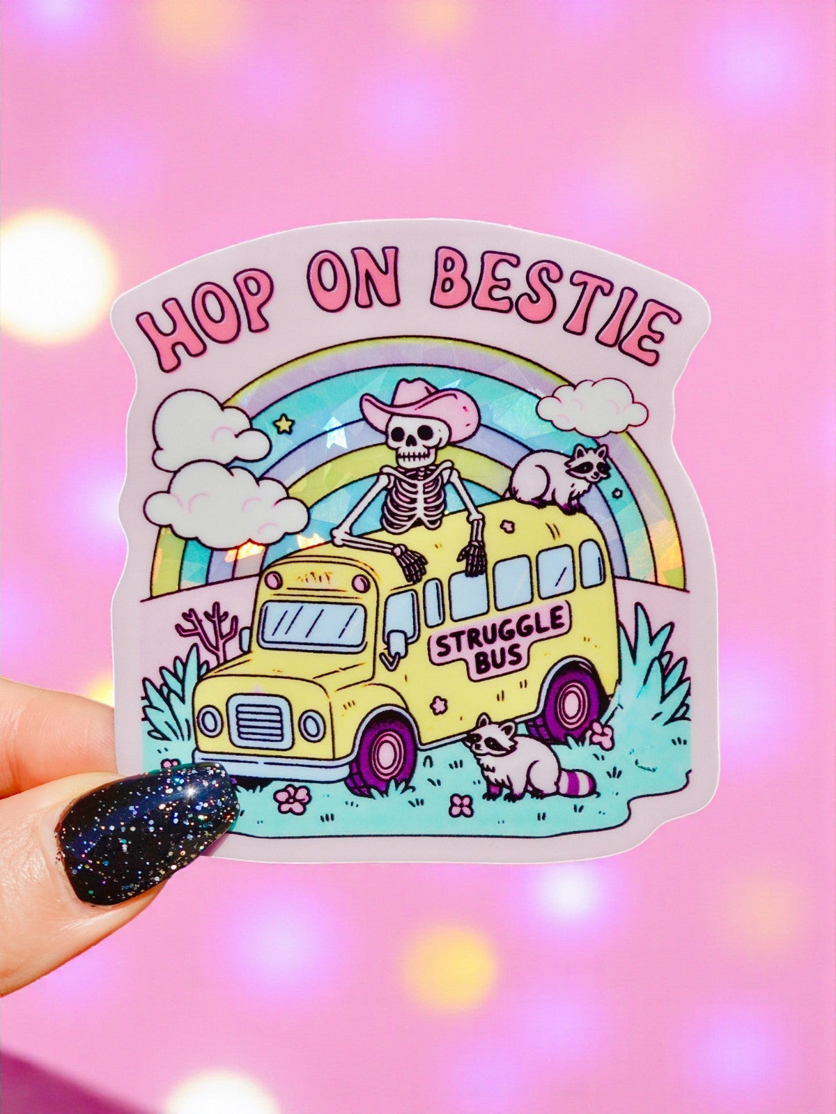 Funny Rainbow struggle bus vinyl sticker with cute skull, cats, and text 'Hop On Bestie'.