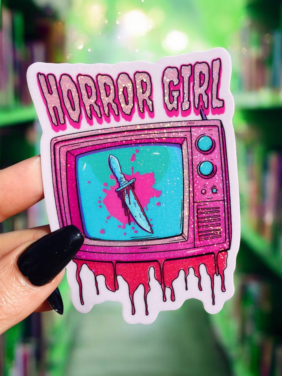 Funny Halloween sticker of a cartoon horror girl TV with dripping white slime and pink frame