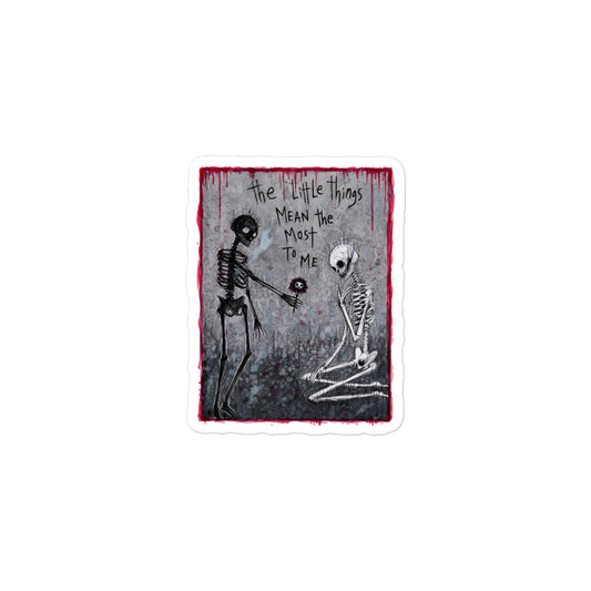 3 x 3 inch 'The Little Things' goth sticker featuring a skeleton offering a flower to a kneeling skeleton, with the words "The little things mean the most to me"