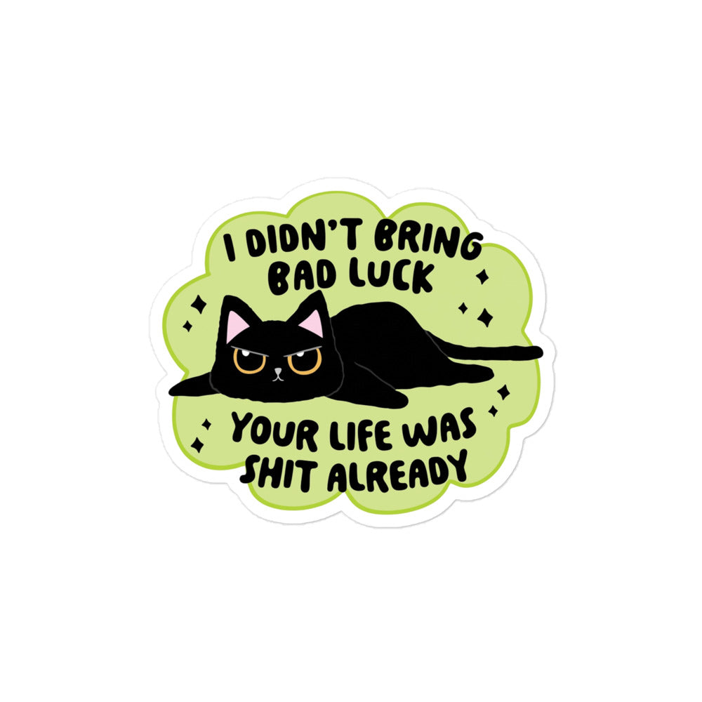 Funny Bubble-free sticker with black cat lying down on neon-green speech bubble, 'BAD LUCK'