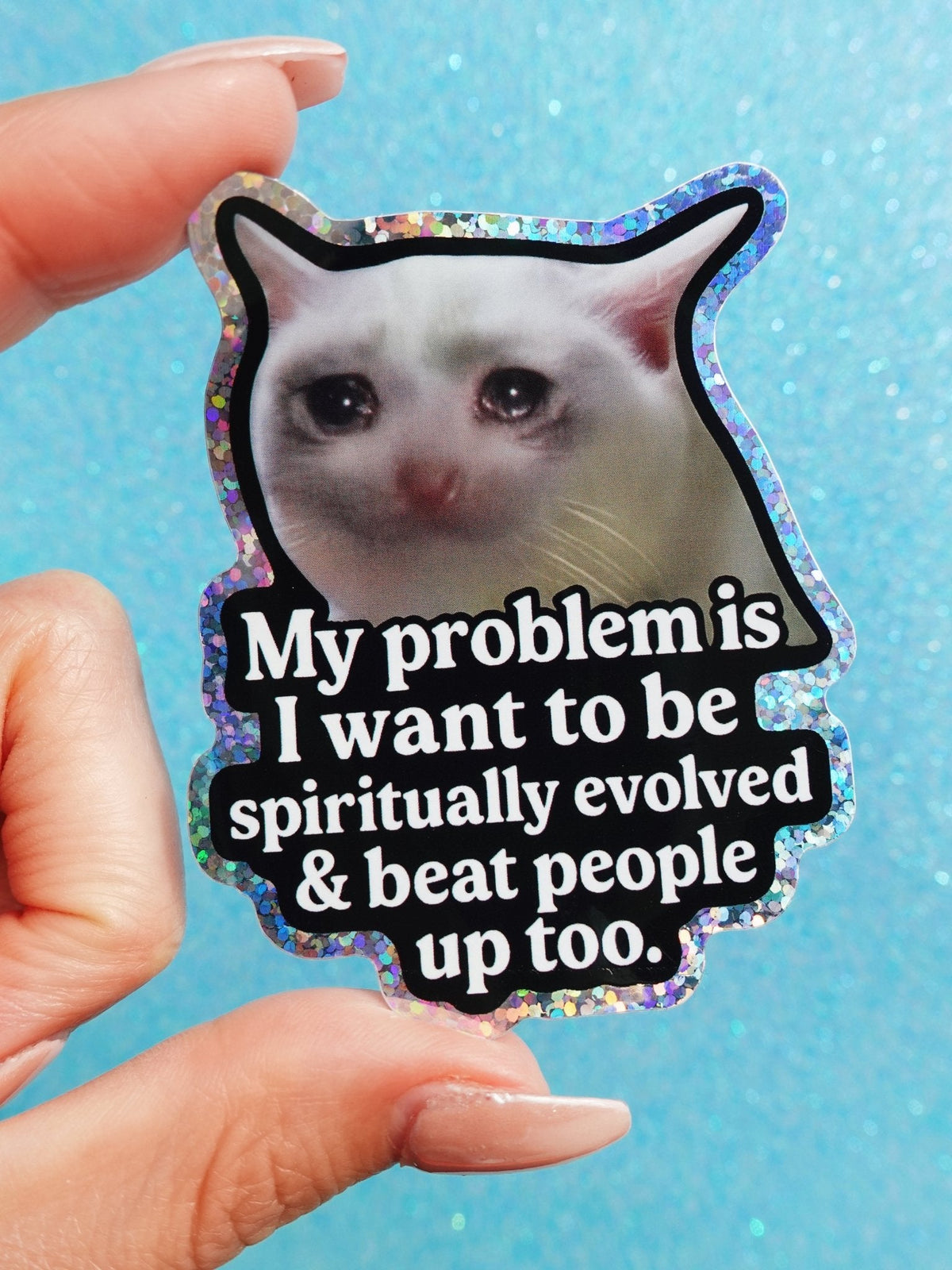 Funny White cat face sticker with black outline; text: “My problem is I want to be spiritually evolved”