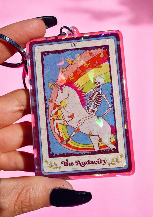 Funny Holographic keychain with 'IV' card art reading 'The Audacity' and skeleton figure
