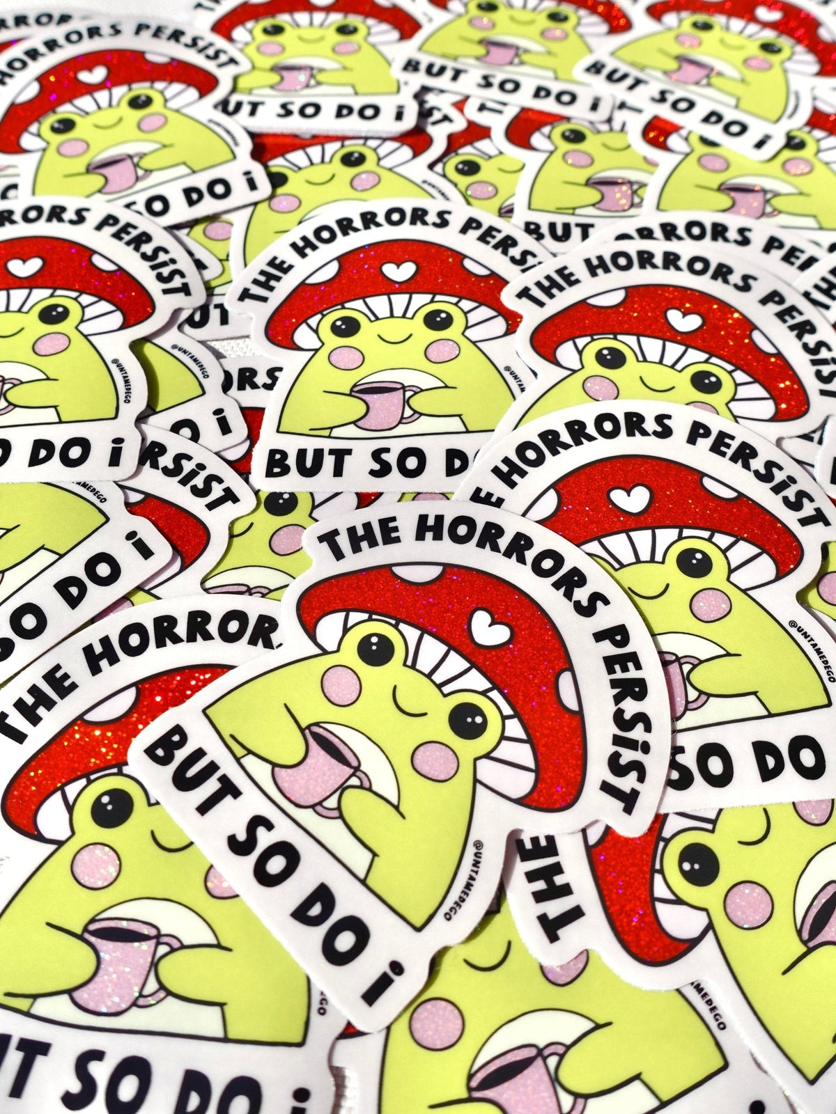 Funny Sheet of cute dinosaur stickers with red glitter, 'THE HORRORS PERSIST' 'BUT SO DO I'