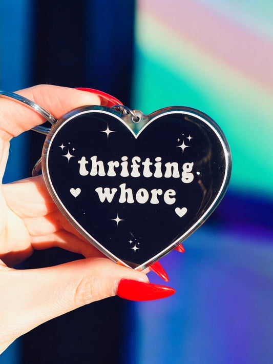Funny Black heart keychain with "thrifting whore" text, star sparkles, and silver ring