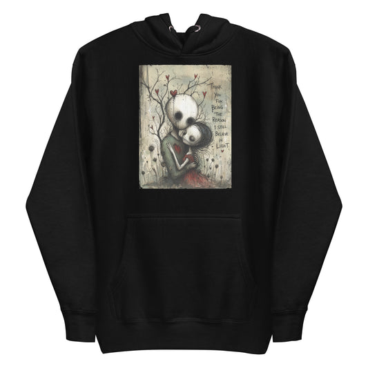 Black pullover hoodie with the 'My Light In Dark Places' goth graphic: a skull-faced couple embracing under a bare tree with red hearts, with the words "Thank you for being the reason I still believe in light"