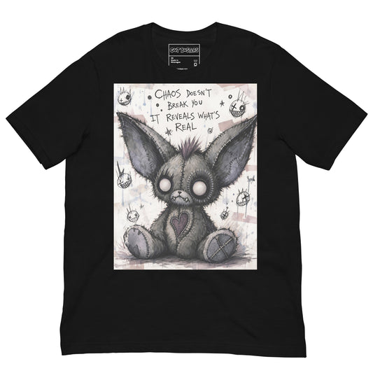 Black unisex t-shirt with the 'Chaos' goth graphic: a stitched gray big-eared creature with button eyes, with the words "Chaos doesn't break you, it reveals what's real"