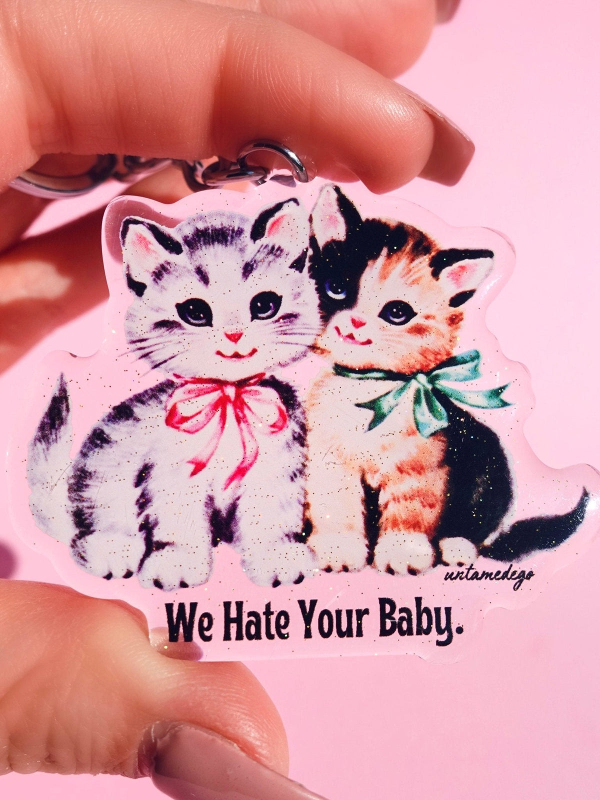 Funny Acrylic keychain with two cartoon kittens and 'We Hate Your Baby!' text