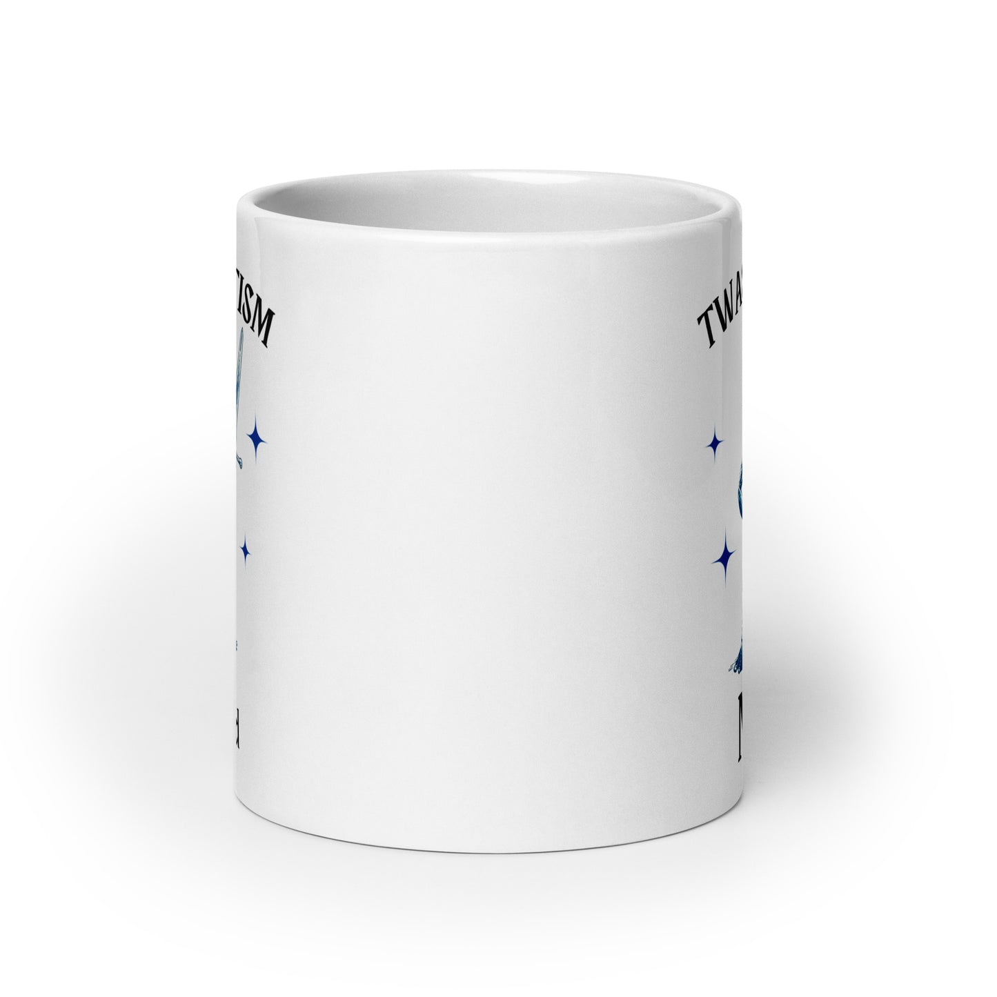 White glossy mug back with partial blue stars and 'Twas the Tism' text