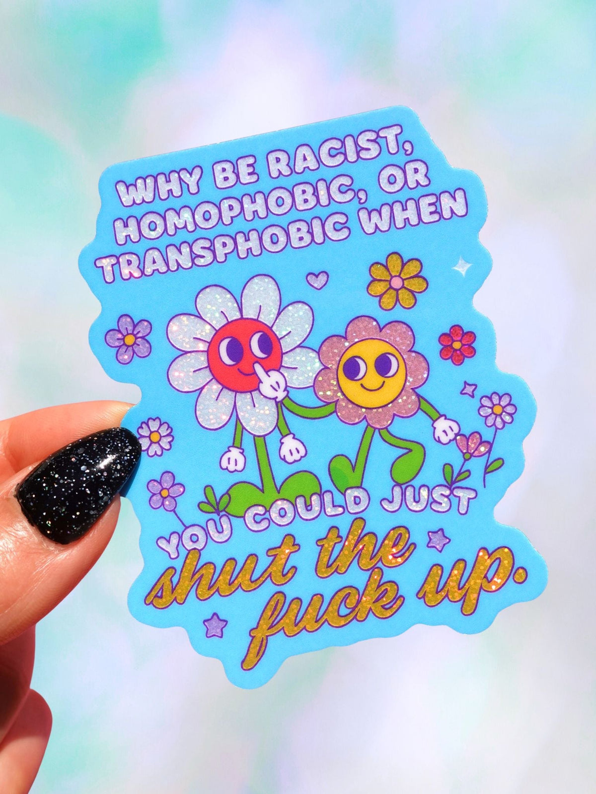 Funny Colorful anti-hate sticker with cartoon flowers; text says 'shut the fuck up'.