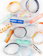 Variety of Elevated Faith Christian Jewelry Bracelets with colorful designs and inspirational messages