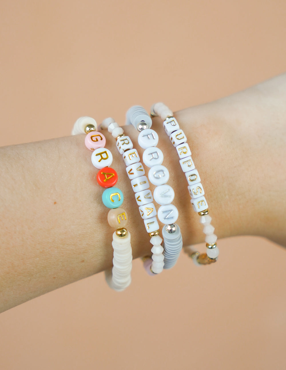 Elevated Faith Christian Jewelry Bracelet set featuring colorful letter beads spelling Grace, Revival, and Purpose