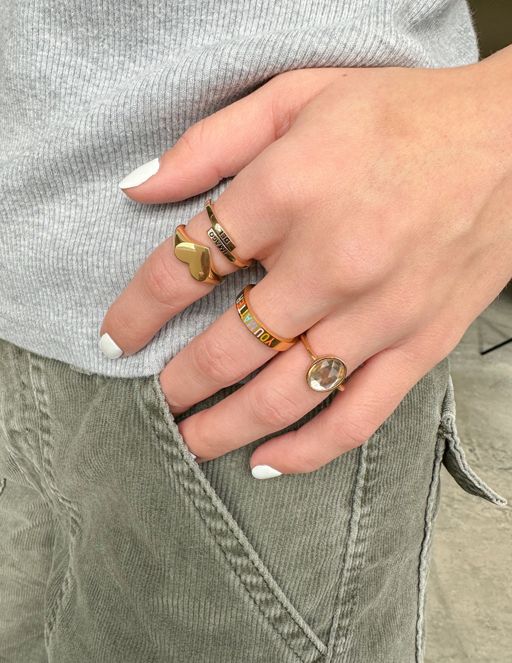 Stack of Elevated Faith rings featuring unique designs, perfect Christian Jewelry for everyday wear