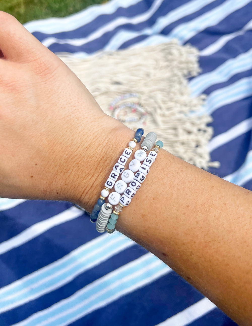 Elevated Faith Christian Jewelry Bracelet featuring letters that spell Grace and Promise on a colorful band