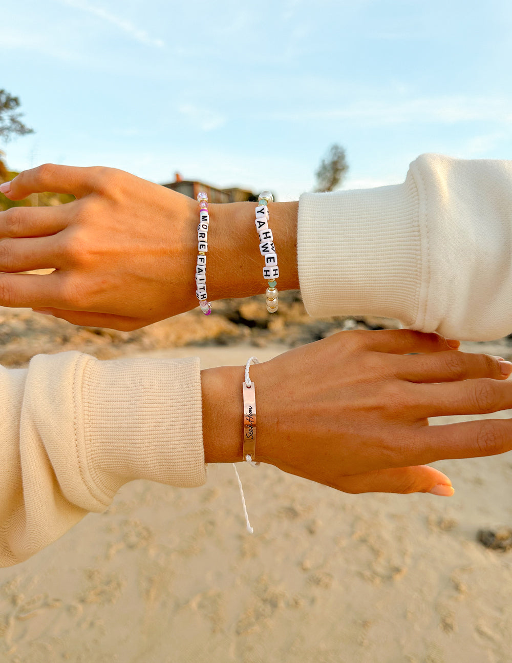 Elevated Faith Christian Jewelry Bracelet with colorful letters and beads on a beach background