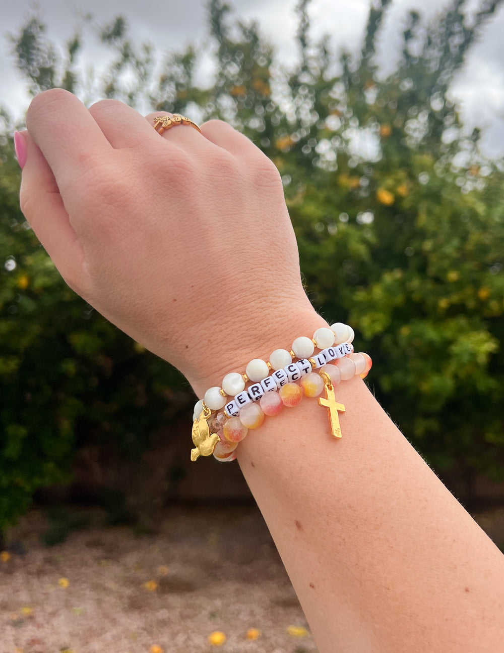 Elevated Faith Christian Jewelry Bracelet with 'Perfect Love' beads and a gold cross charm