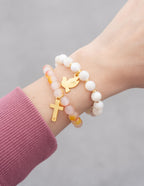 Elevated Faith Christian Jewelry Bracelet set featuring cross and dove charms on colorful stone strands