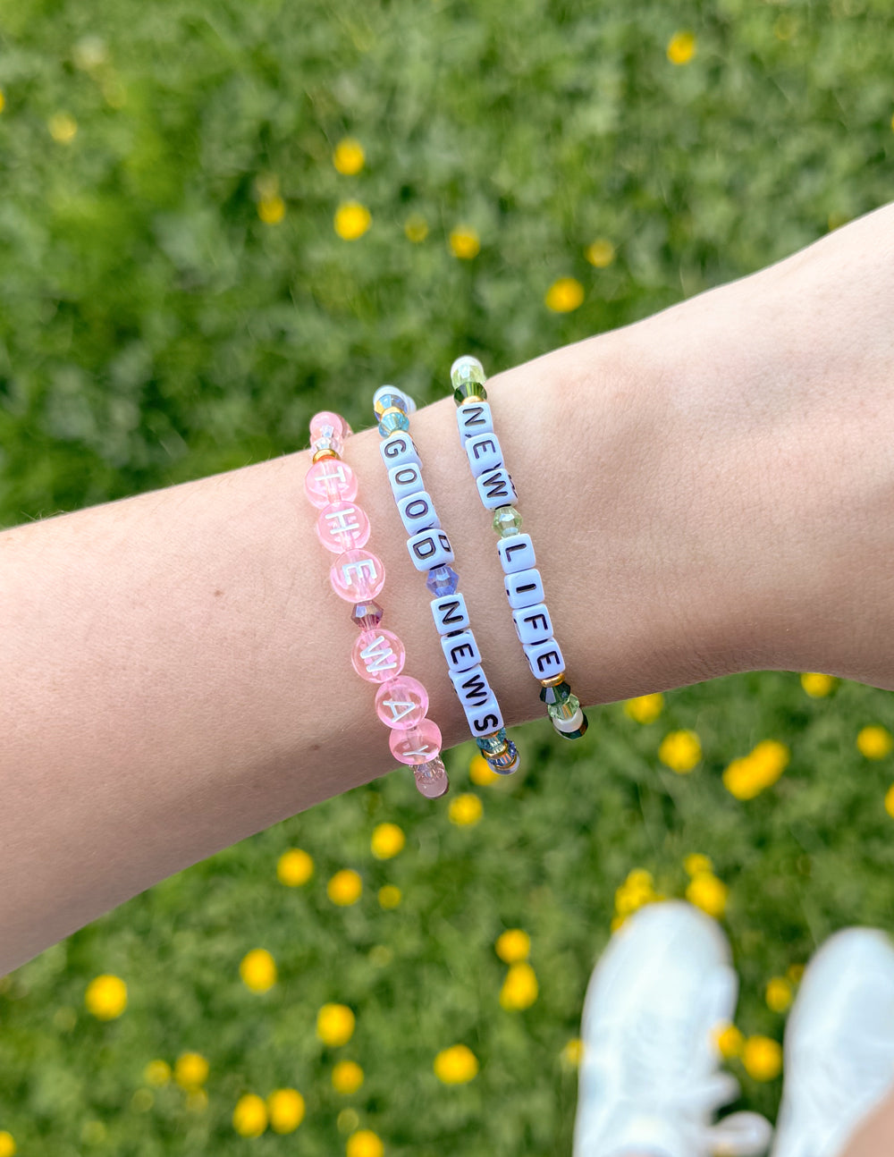 Three colorful Elevated Faith Christian Jewelry Bracelets featuring inspiring messages for everyday wear
