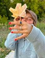 Elevated Faith Christian Jewelry Ring showcased with a dried leaf in a nature setting