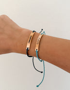 Elevated Faith Christian Jewelry Bracelet in blue and black with engraved messages on metal tags
