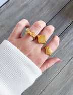 Gold Elevated Faith rings worn on fingers showcasing stylish Christian Jewelry design