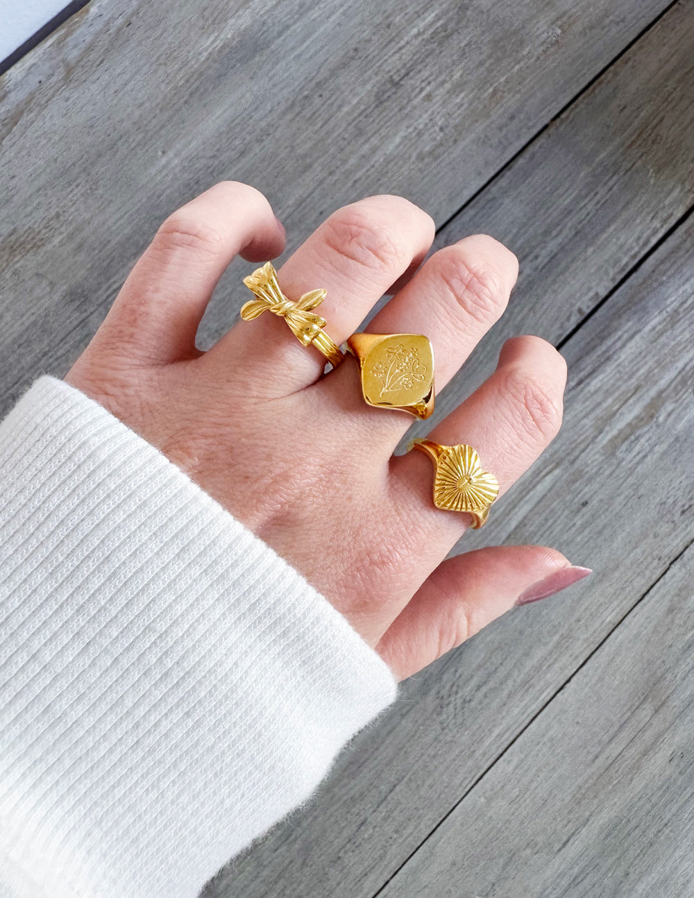 Gold Elevated Faith rings worn on fingers showcasing stylish Christian Jewelry design