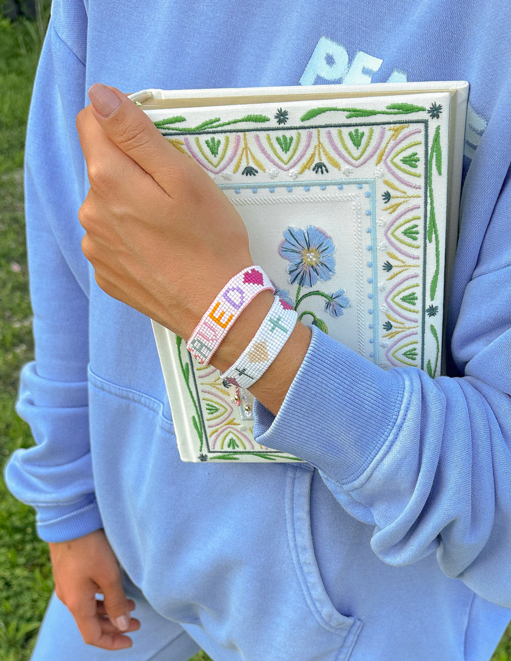 Elevated Faith Christian Jewelry Bracelet worn on wrist, paired with a stylish cozy outfit