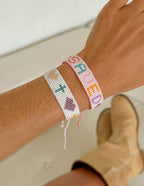 Elevated Faith Christian Jewelry Bracelet with colorful beads and inspirational symbols on a model's wrist