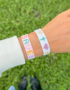 Elevated Faith Christian Jewelry Bracelet with colorful letters and symbols on a woven design