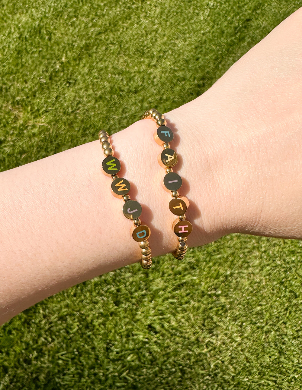 Elevated Faith Christian Jewelry Bracelet featuring beads with WWJD and FAITH letters on a gold stretch band