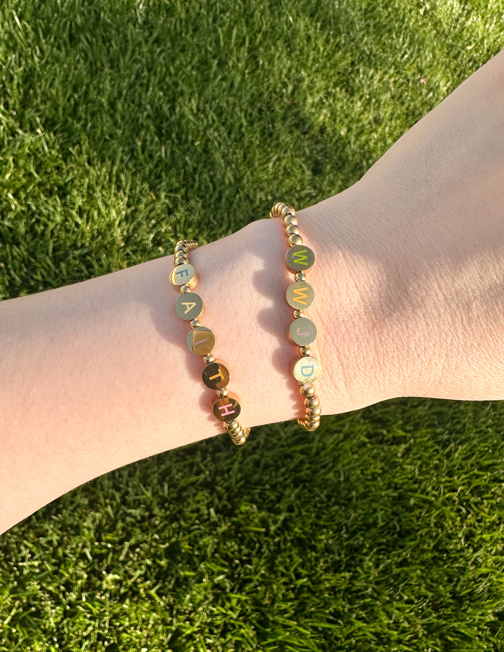 Elevated Faith Christian Jewelry Bracelet with gold letters spelling faith on a beaded design