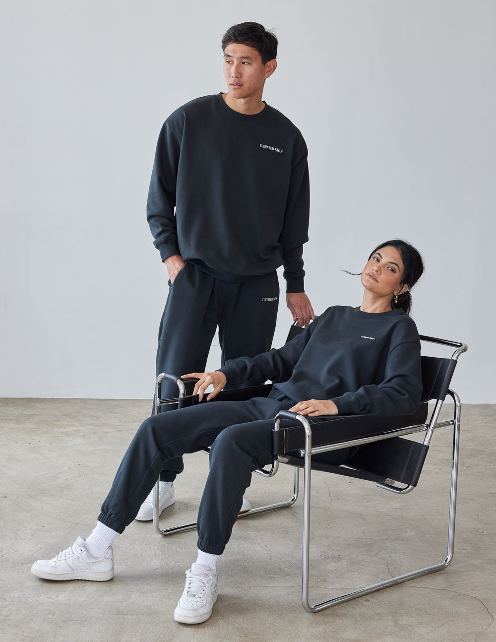 Elevated Faith Christian Crewneck Sweatshirt in Dark Color, Styled with Matching Sweatpants