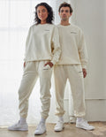 Elevated Faith Christian Crewneck Sweatshirt in neutral color worn by a man and woman
