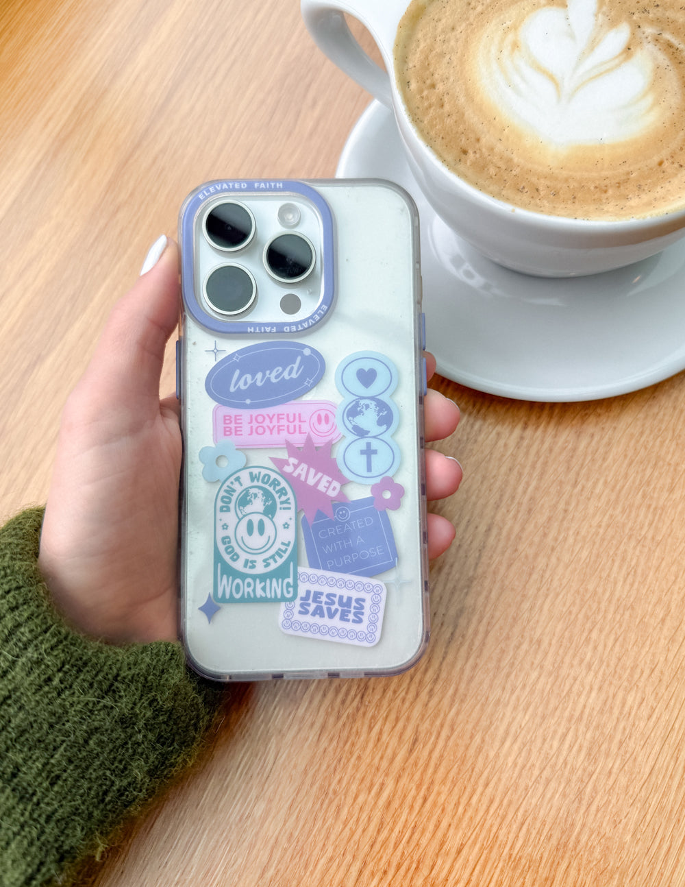 Elevated Faith Christian iPhone Case with colorful sticker designs promoting joy and faith