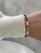 Elevated Faith Christian Jewelry Bracelet with a copper tag and braided string for a stylish faith accessory