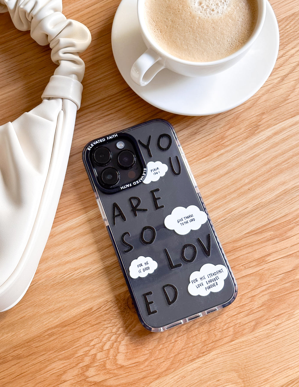 Elevated Faith Christian iPhone Case with uplifting messages and cloud designs on a black background