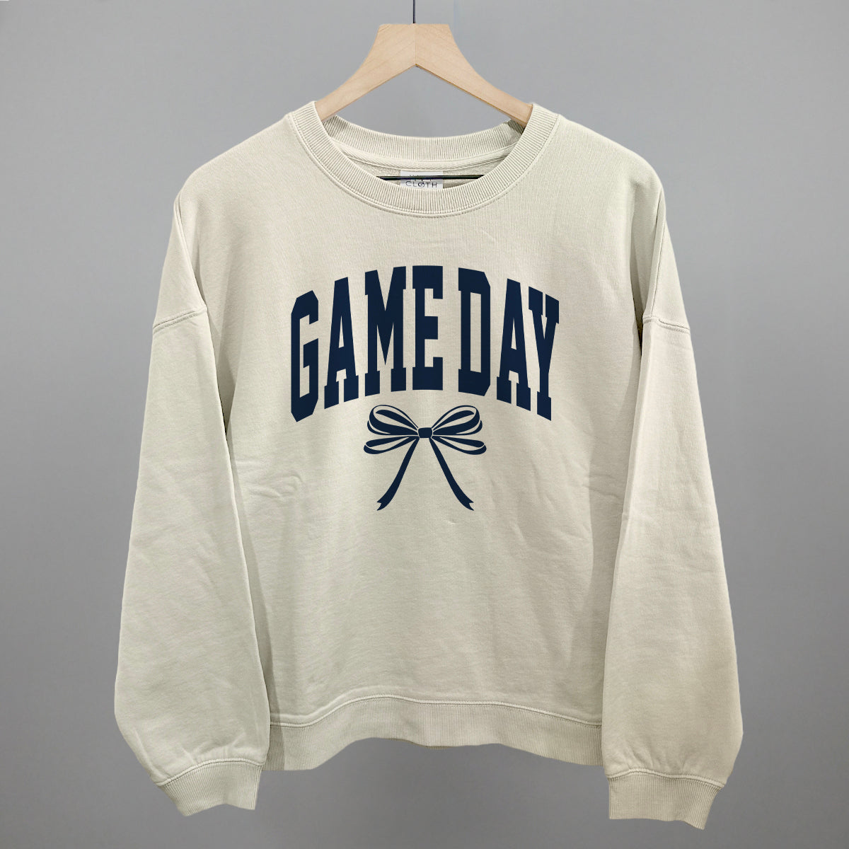 Game Day Arch And Bow Funny Oversized Boxy Crewneck Sweatshirt in Bone – Ivy + Cloth
