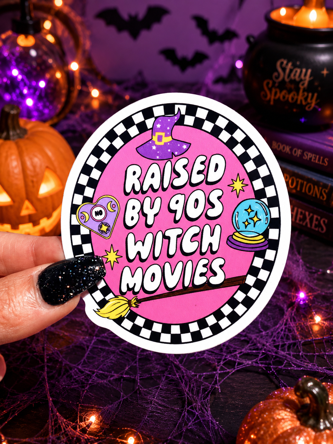 Funny Halloween sticker featuring a purple witch hat and pink text “Raised By 90s Witch Movies”