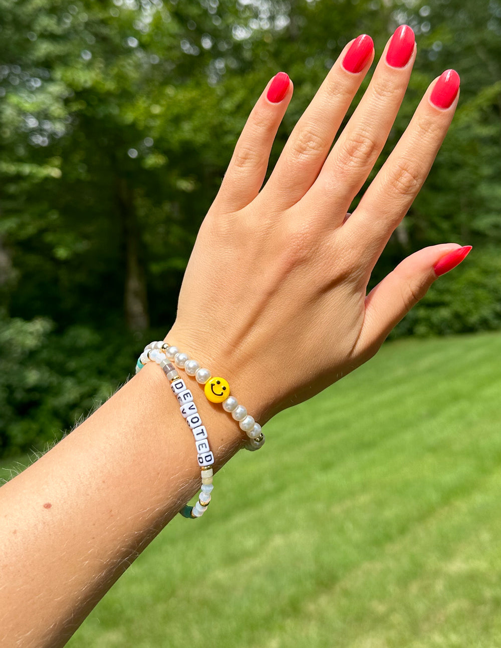 Elevated Faith Christian Jewelry Bracelet featuring colorful beads and a smiley face charm