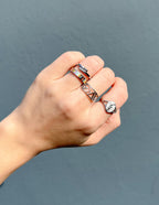 Set of Elevated Faith Christian Jewelry rings on a hand showcasing unique designs and messages of faith