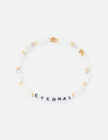 Elevated Faith Christian Jewelry Bracelet featuring white beads and black letter beads spelling ETERNAL