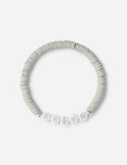 Elevated Faith Christian Jewelry Bracelet with white letter beads spelling FRGVN on a grey beaded band