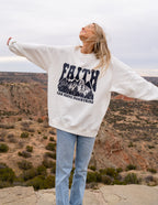 Elevated Faith Christian Crewneck Sweatshirt featuring mountains and faith-based design for casual wear
