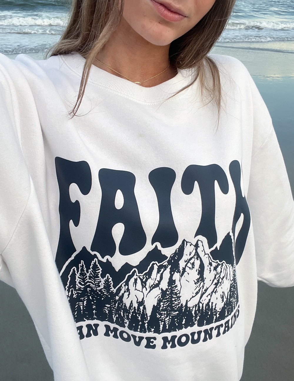 Elevated Faith Christian Crewneck Sweatshirt featuring a mountain graphic and faith message
