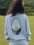 Elevated Faith Christian Crewneck Sweatshirt featuring a scenic mountain design on the back