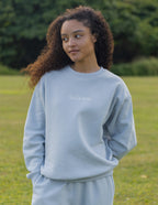Light blue Christian Crewneck Sweatshirt featuring 'God is here' text for casual comfort