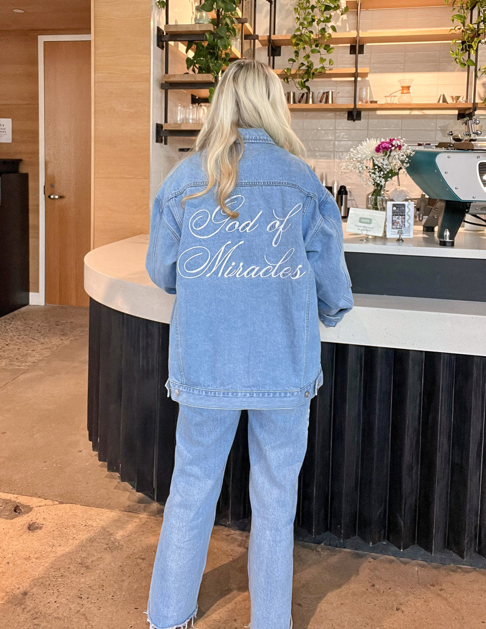 Elevated Faith Christian Jacket with 'God of Miracles' embroidery on a denim fabric